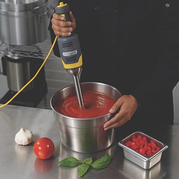 immersion-blender-hand-mixer-pizza-sauce Immersion blender / hand mixers for restaurants. Blending tomato sauce.
