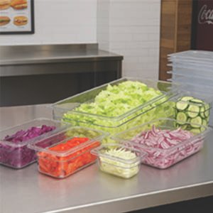 poly pans used for a prep station sitting on a stainless steel work table