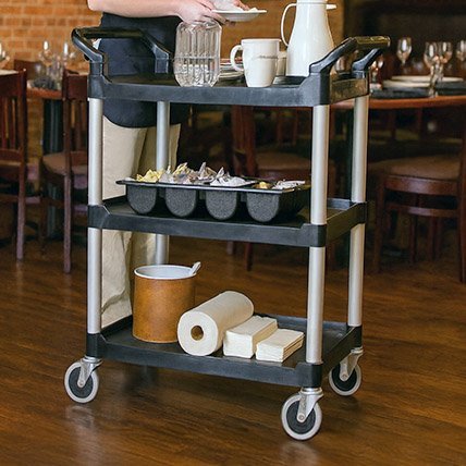 server-with-serving-cart Utility cart with food pans at catering event. Items that can be purchased at Central Florida Restaurant Supply