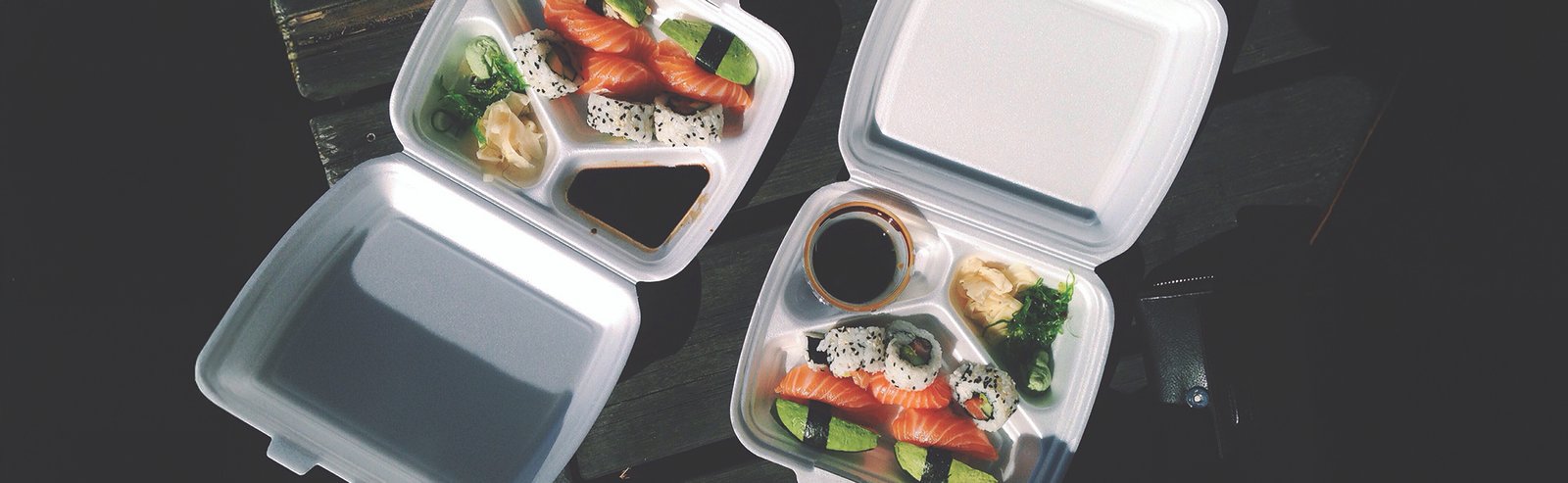 Three compartment to go container with portion cups to represent the disposable items Central Florida Restaurant Supply has in stock. 