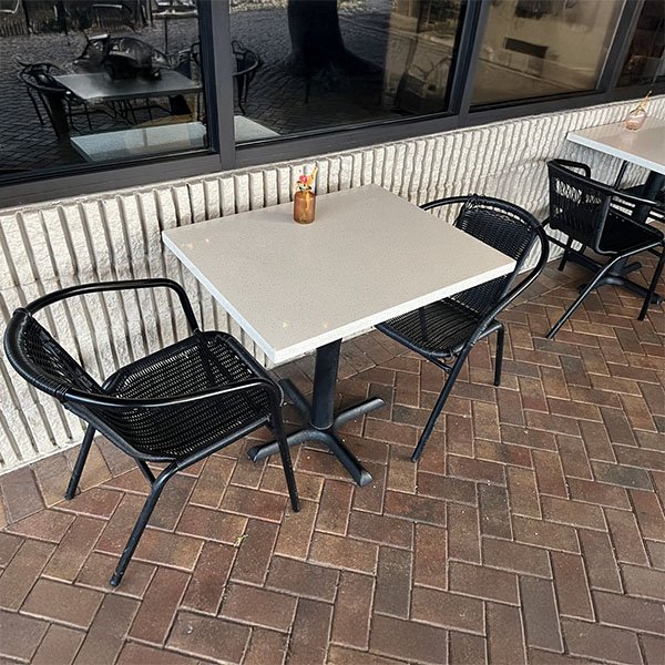 stone-tables-and-aluminum-chairs-on-a-coffee-patio-with-brick-pavers Commercial countertop refrigeration at a hotel.